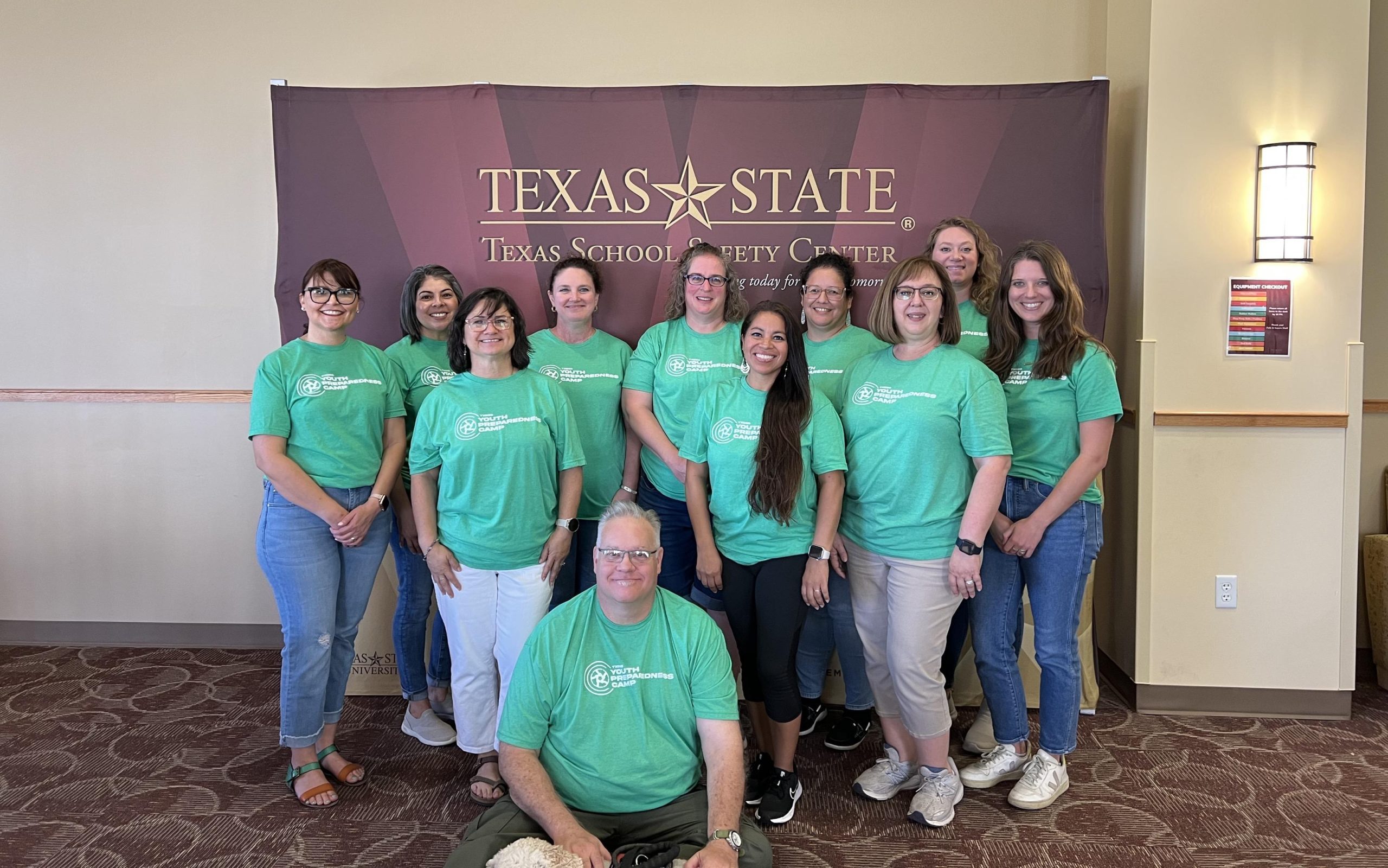 A group photo of the Texas School Safety Center Staff at an event